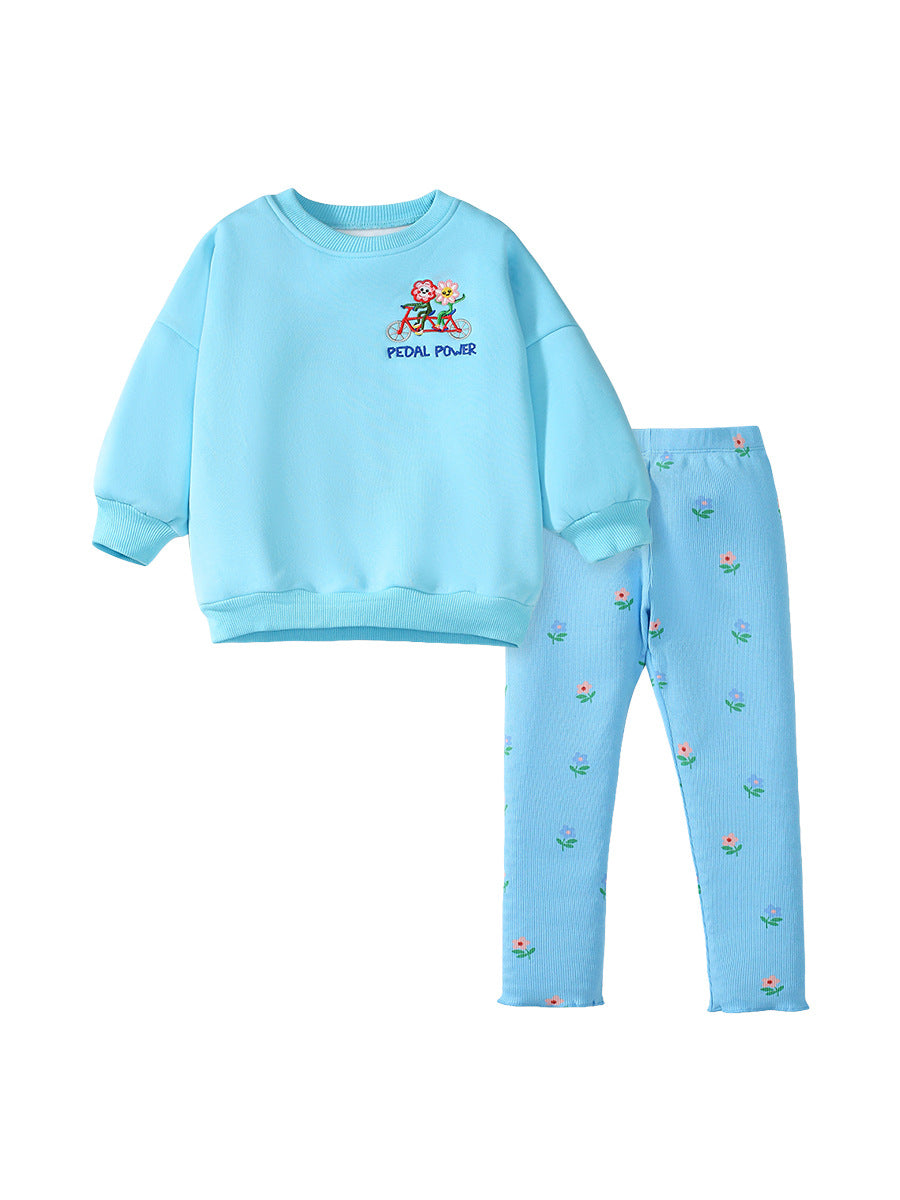 A blue long-sleeve top for girls featuring a colorful cartoon flowers pattern, made from cotton and polyester, perfect for spring and autumn wear.