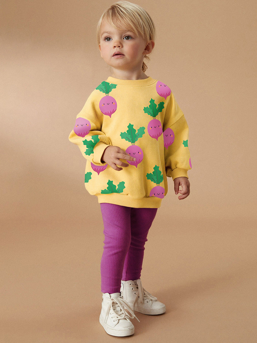 A bright yellow long sleeves top featuring a cute turnip cartoon pattern, designed for girls aged 12 months to 10 years.