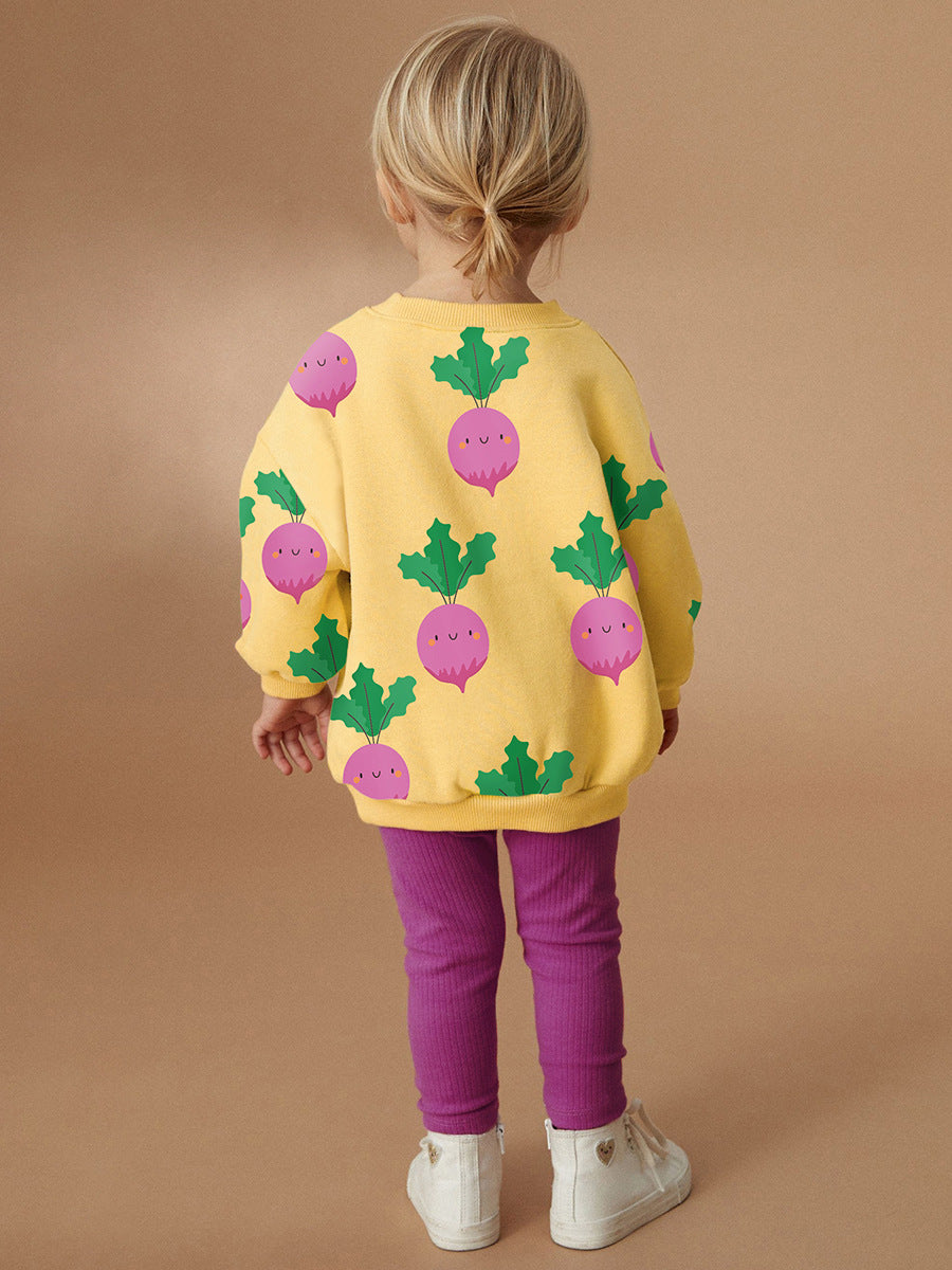 A bright yellow long sleeves top featuring a cute turnip cartoon pattern, designed for girls aged 12 months to 10 years.