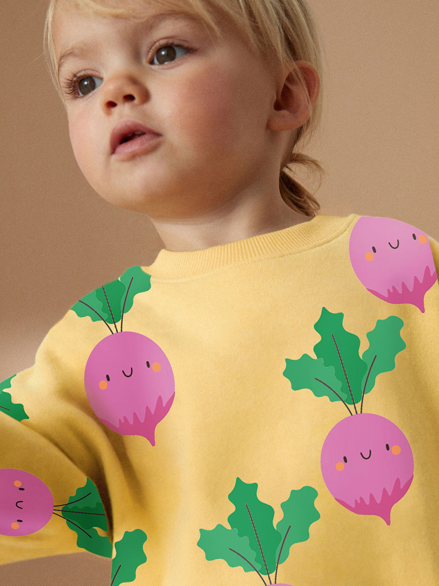 A bright yellow long sleeves top featuring a cute turnip cartoon pattern, designed for girls aged 12 months to 10 years.