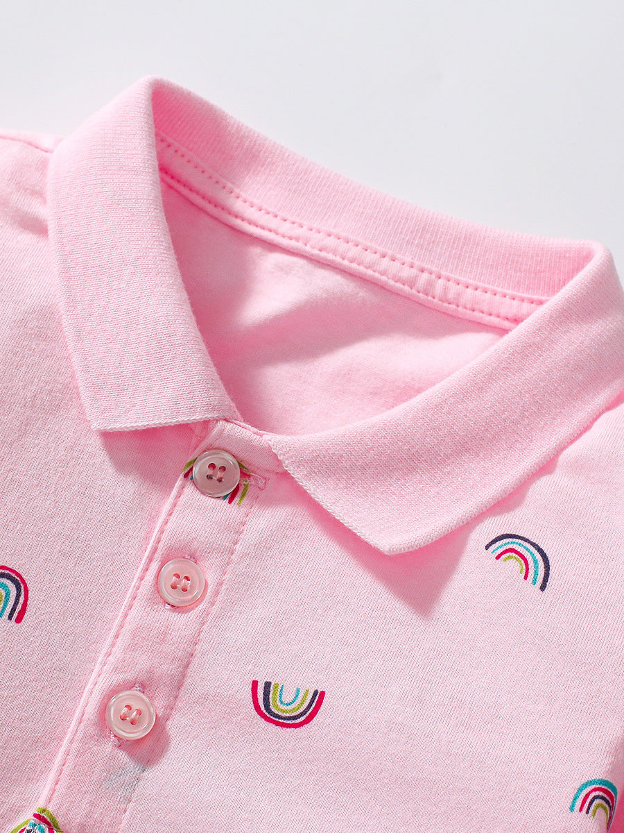 A pink long sleeves polo shirt for girls featuring a vibrant rainbow print, made from soft cotton fabric.