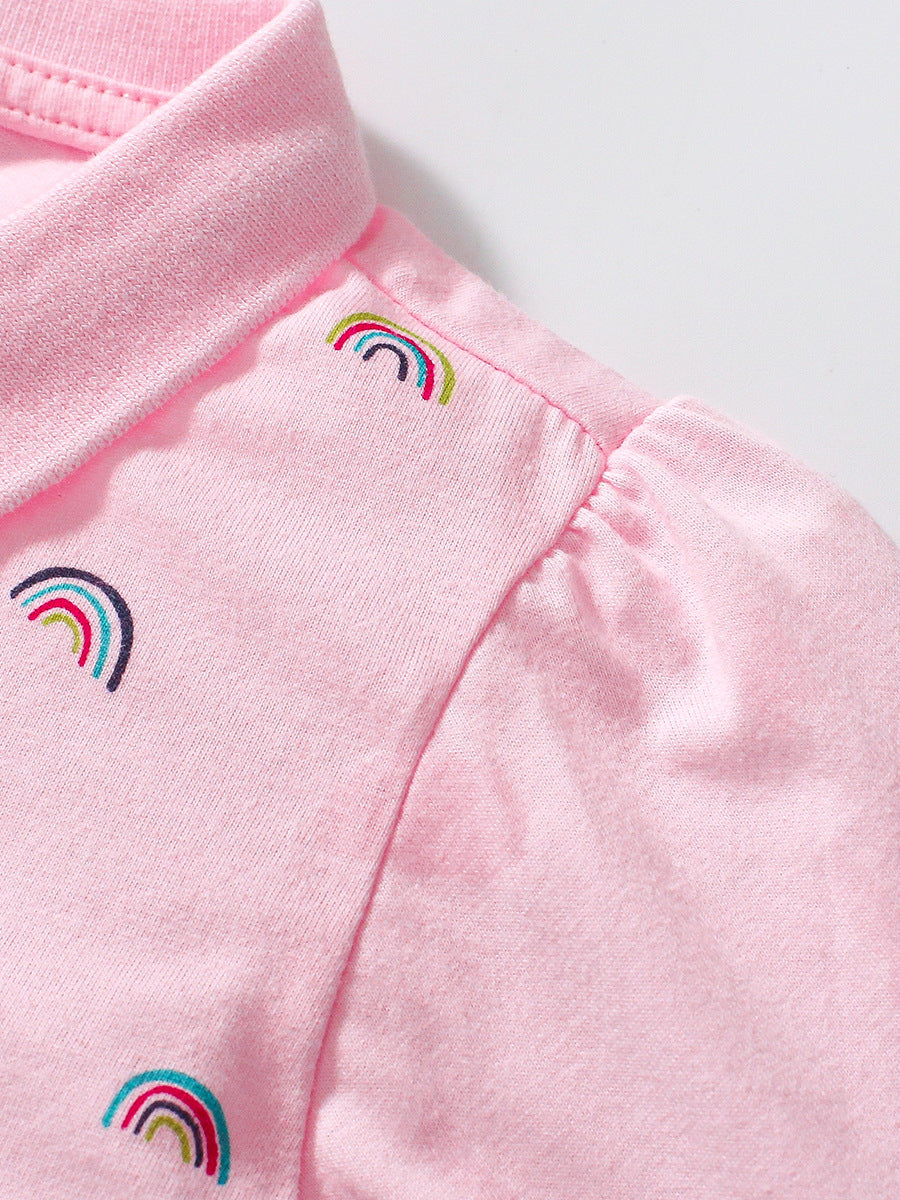 A pink long sleeves polo shirt for girls featuring a vibrant rainbow print, made from soft cotton fabric.