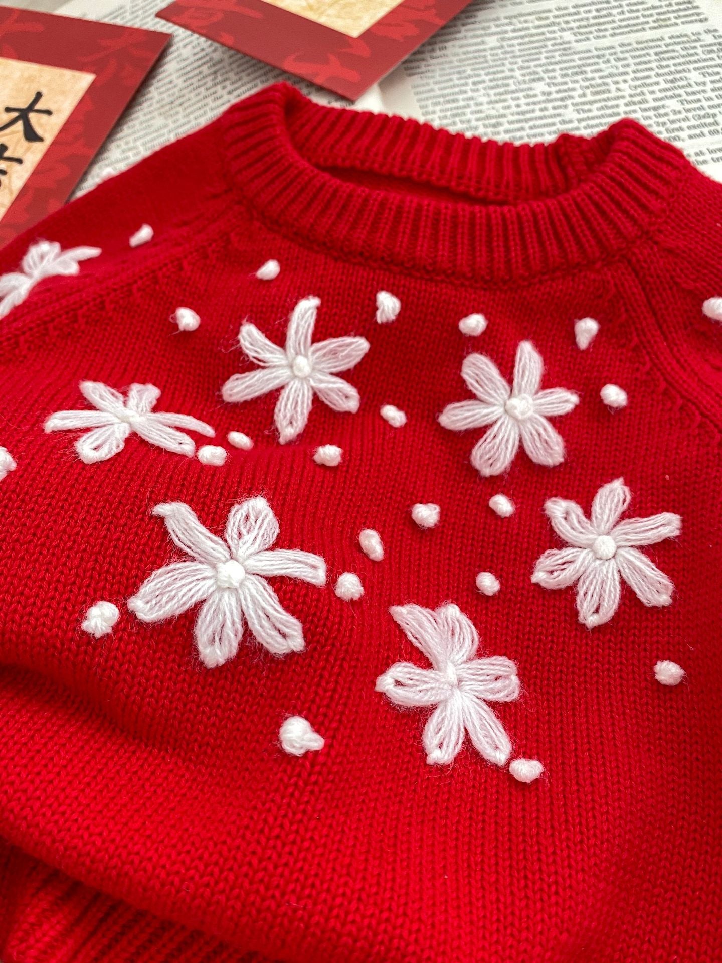 Spring Baby and Kids Girls Floral Knitting Pattern Pullover in white and red colors, showcasing floral design and soft cotton material.