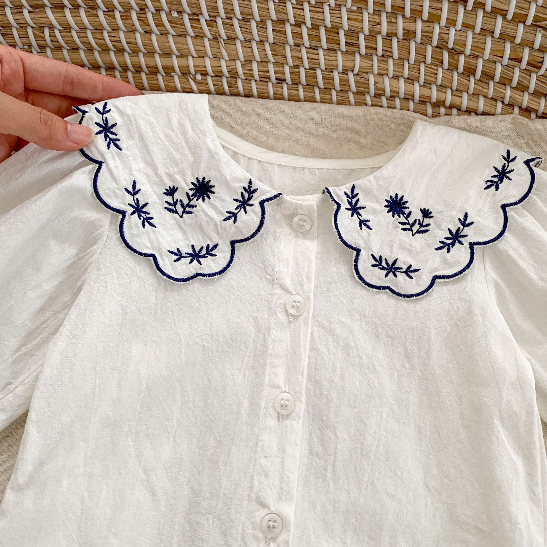 A stylish vintage white shirt with floral patterns paired with elegant black leather shoes for baby girls, perfect for spring and autumn.