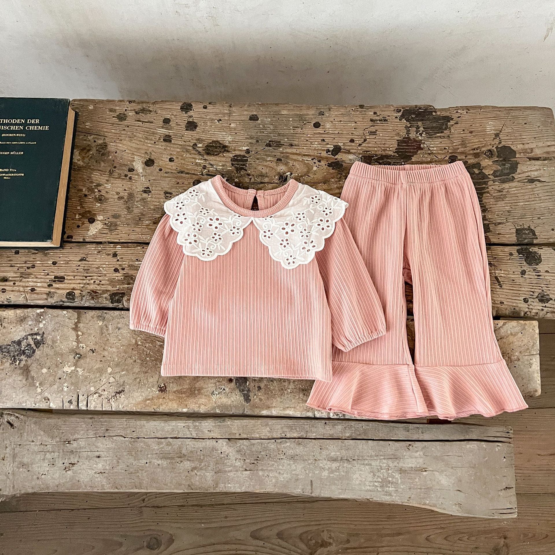 Spring Baby Kids Girls Hollow-Out Collar Top and Flared Pants set in various colors, showcasing stylish design and comfortable fabric.