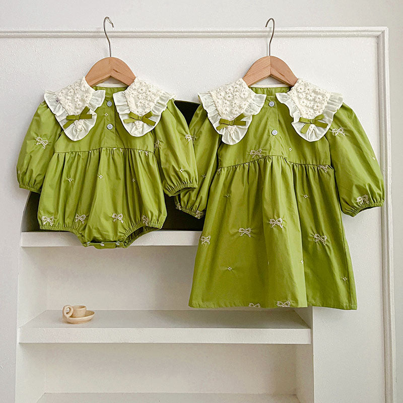 A stylish long sleeve green dress for girls featuring a mesh patched design and embroidered details, perfect for spring and autumn wear.