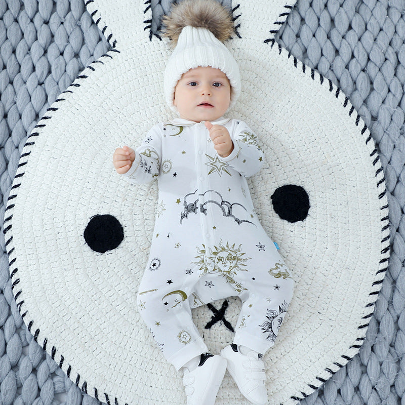 Baby outfit featuring suns, moons, and stars print in white cotton, perfect for spring and autumn.