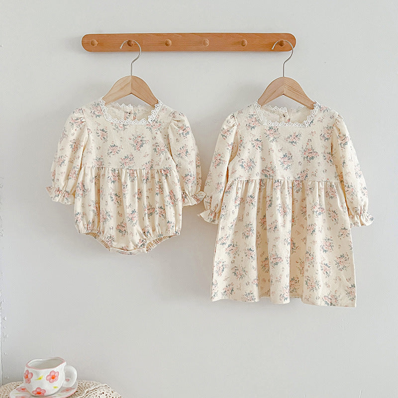 A stylish square neck baby onesie in white and beige, featuring floral embroidery, perfect for baby girls.