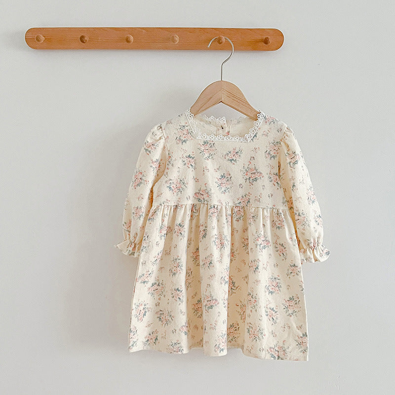 A stylish square neck baby onesie in white and beige, featuring floral embroidery, perfect for baby girls.