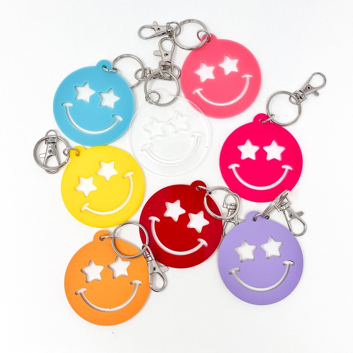 Colorful Stars Smiley Face Keychain made of acrylic, featuring a cheerful smiley face design, available in multiple sizes.