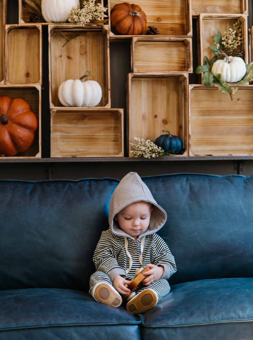 A cozy Hooded Striped Sweatshirt Jumpsuit for babies, featuring a trendy striped pattern and a convenient front zipper.