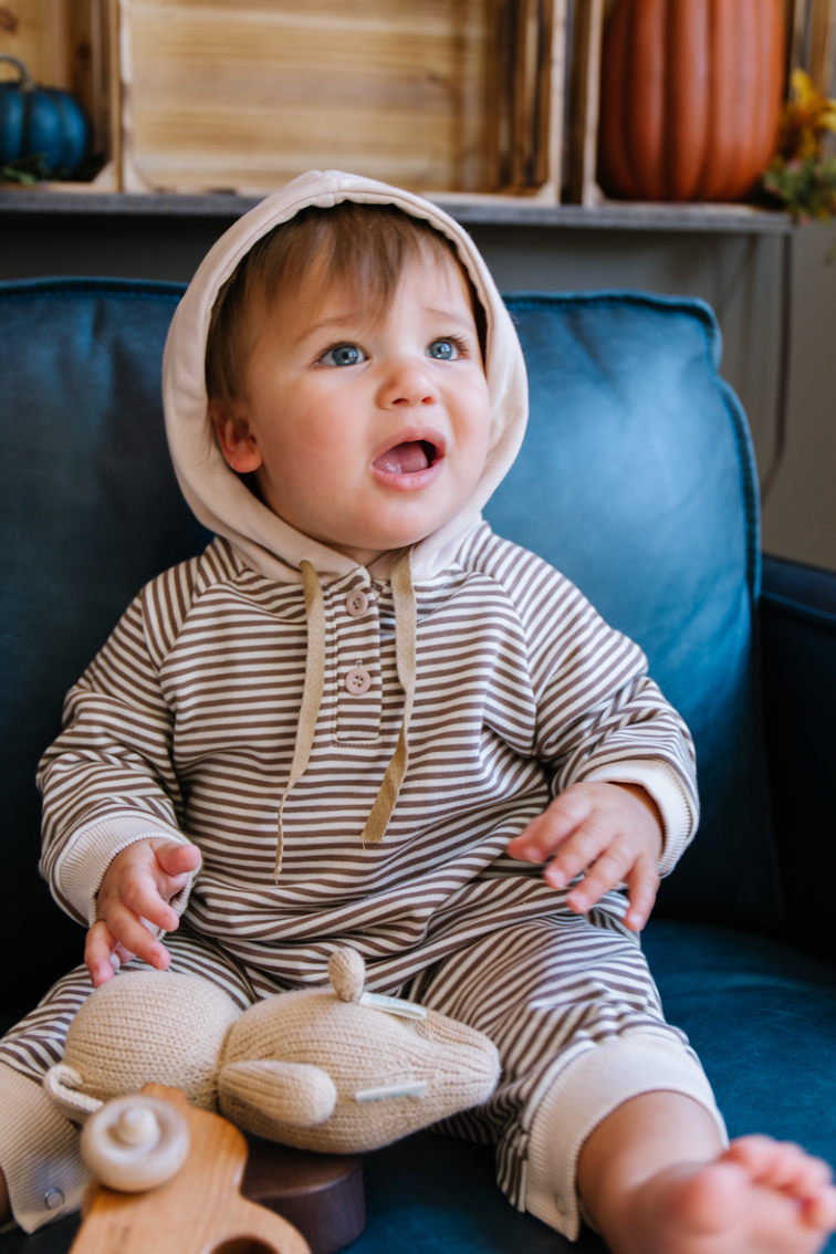 A cozy Hooded Striped Sweatshirt Jumpsuit for babies, featuring a trendy striped pattern and a convenient front zipper.