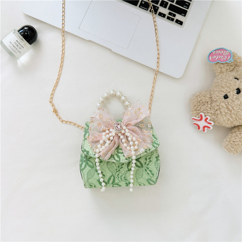 Stylish Floral Carry-On Girls’ Portable Beaded Princess Crossbody bag in various colors with floral patterns.