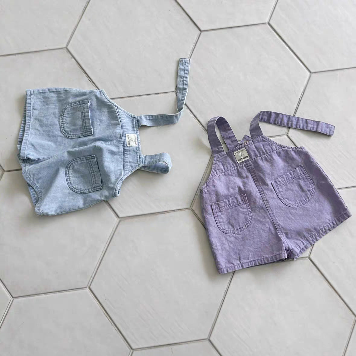 Summer Baby and Kids Unisex Solid Color Denim Overalls in blue and purple, made from breathable cotton for comfort.