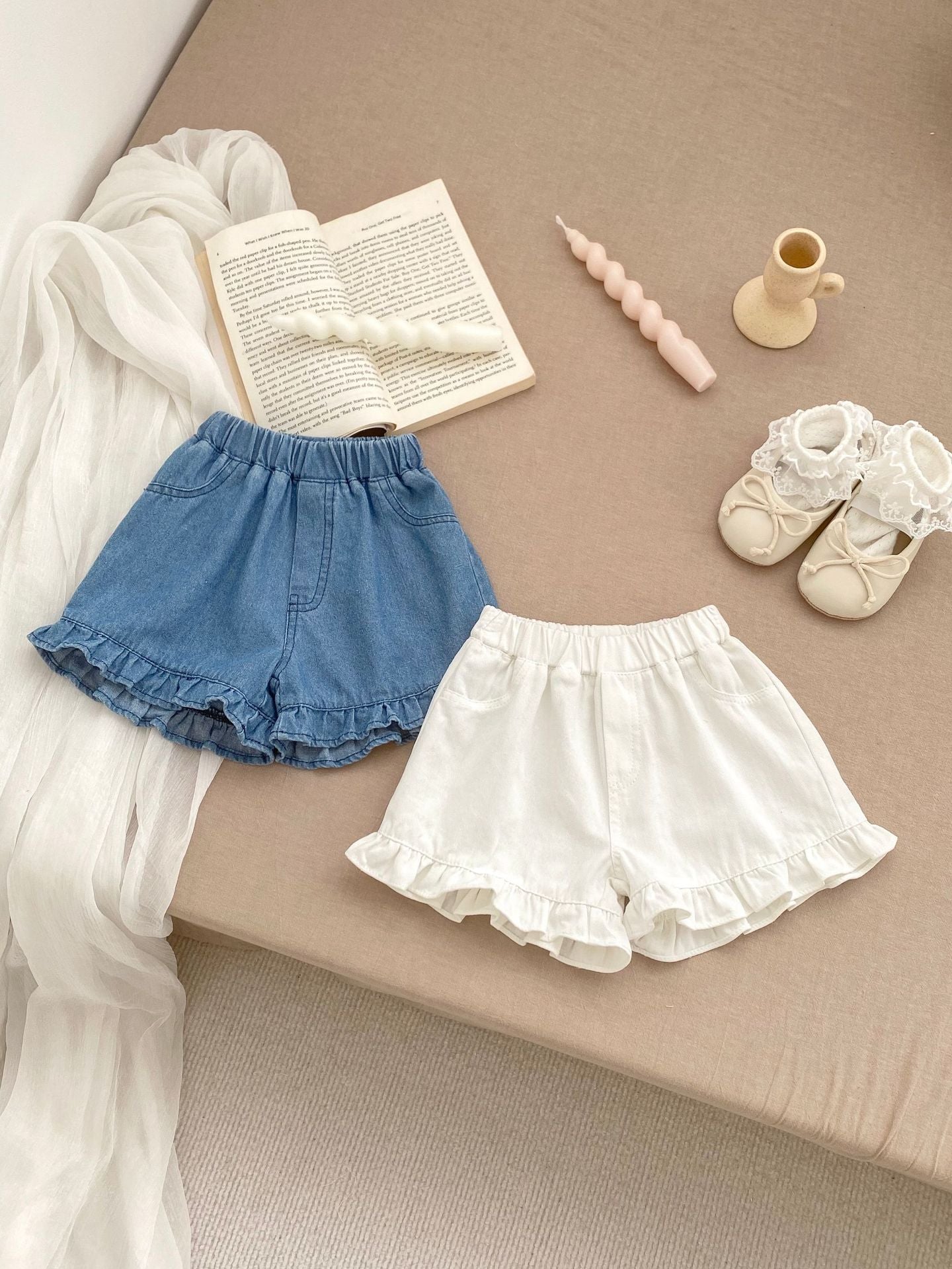 Summer Baby Girl Solid Color Ruffle Trim Denim Shorts in white and blue, featuring a cute ruffle trim design.