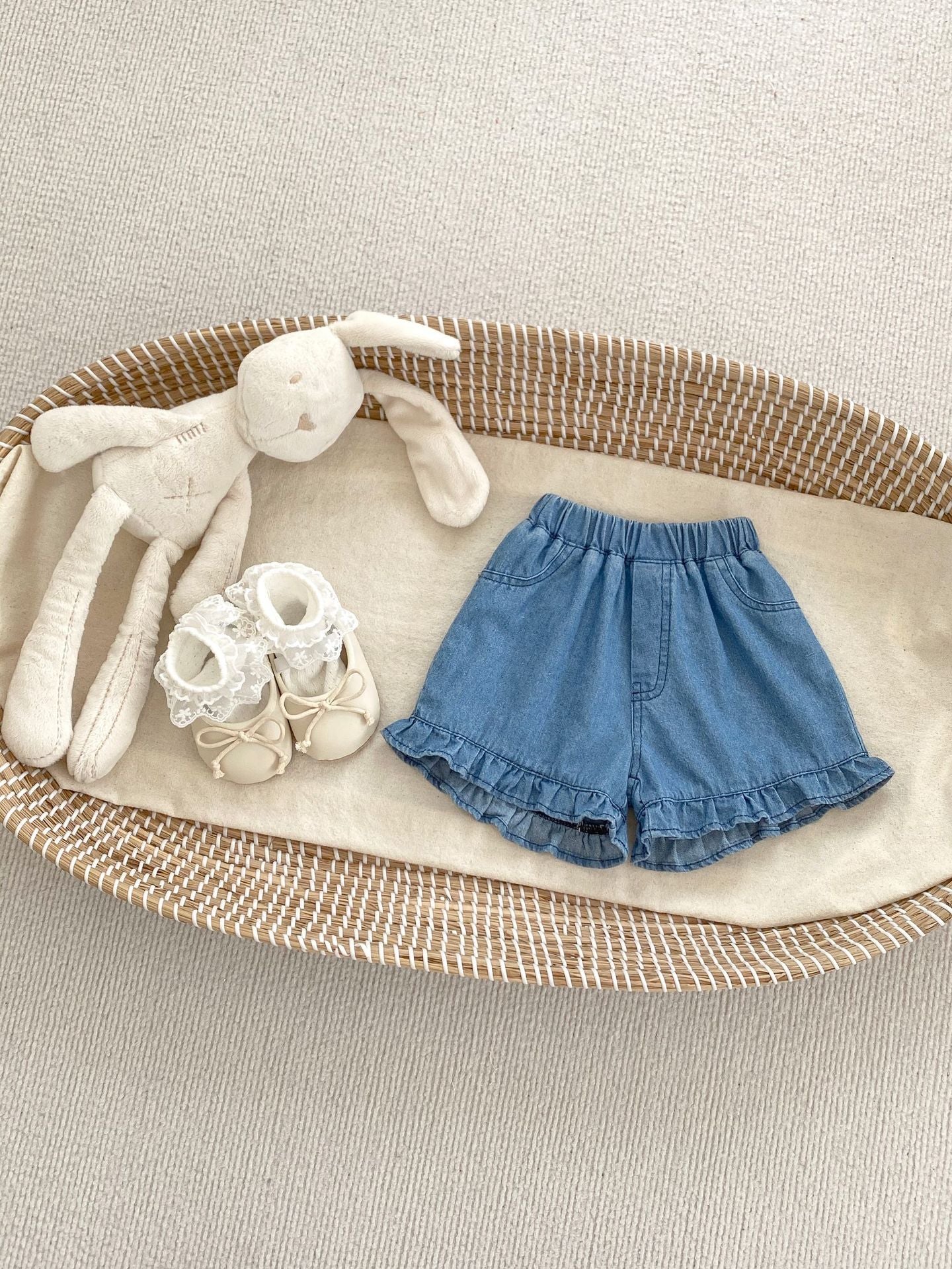 Summer Baby Girl Solid Color Ruffle Trim Denim Shorts in white and blue, featuring a cute ruffle trim design.