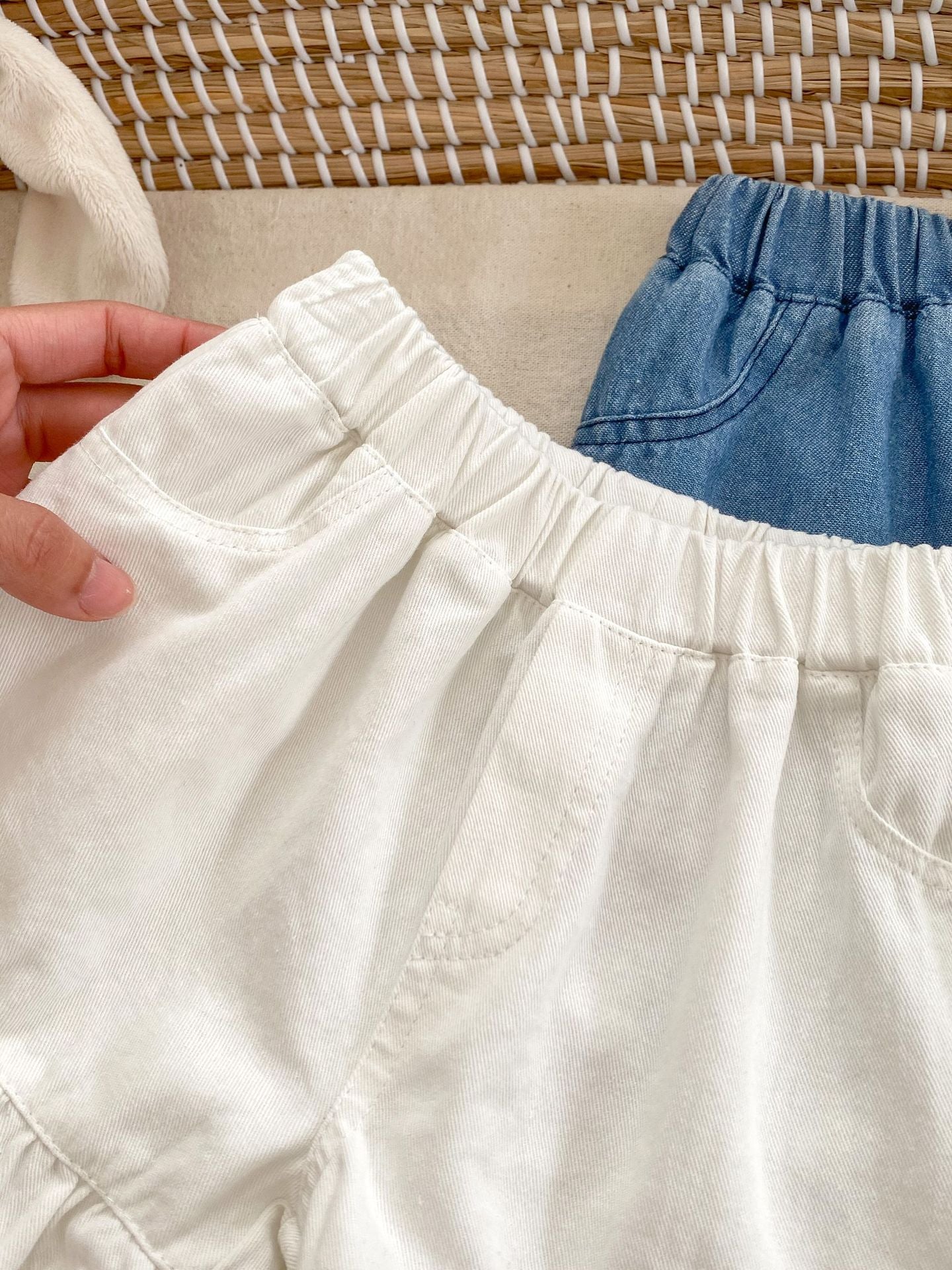 Summer Baby Girl Solid Color Ruffle Trim Denim Shorts in white and blue, featuring a cute ruffle trim design.