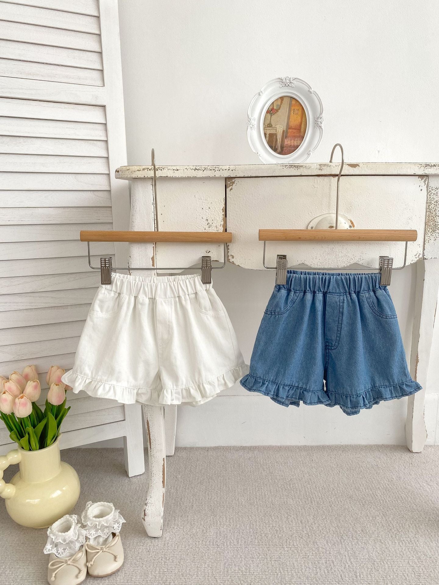 Summer Baby Girl Solid Color Ruffle Trim Denim Shorts in white and blue, featuring a cute ruffle trim design.