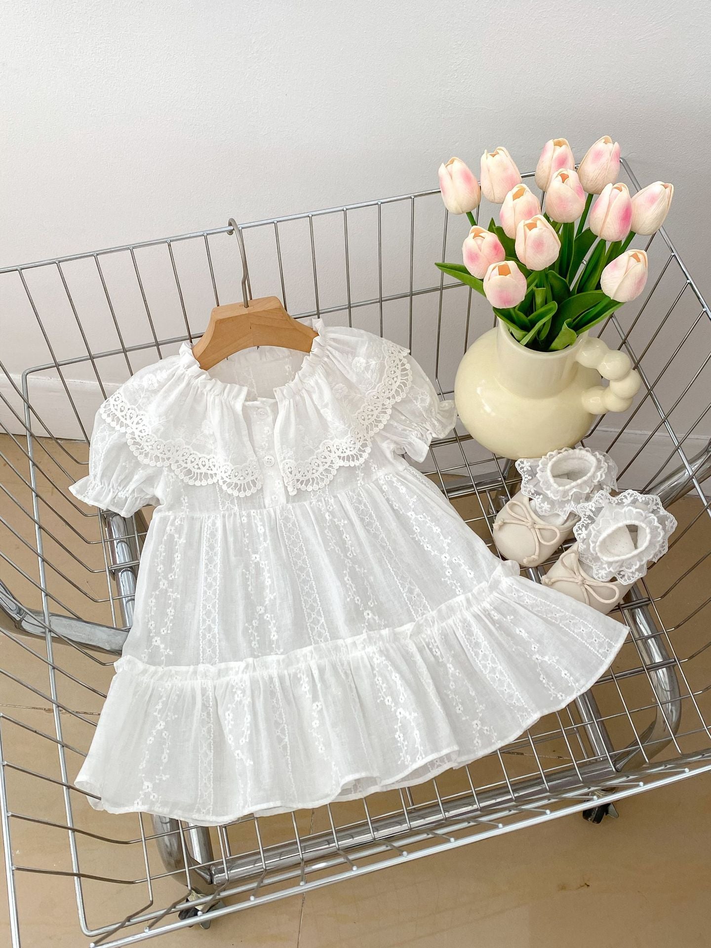 Summer Baby Girls dress featuring floral embroidery and lace collar, available in white and beige, perfect for warm weather.