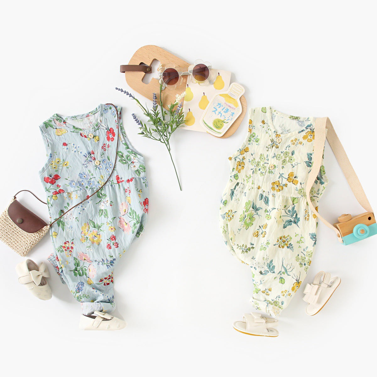 Summer baby girls floral pattern sleeveless V neck romper in blue and apricot colors, made from cotton blend fabric.