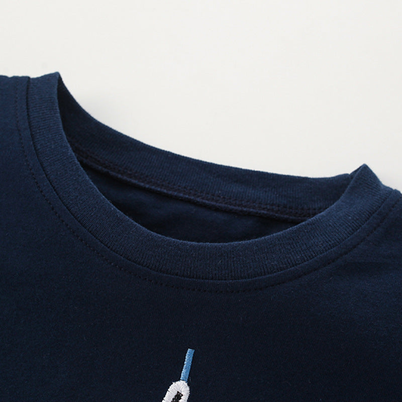 Navy blue t-shirt for boys featuring a cartoon sailboat pattern, perfect for summer wear.