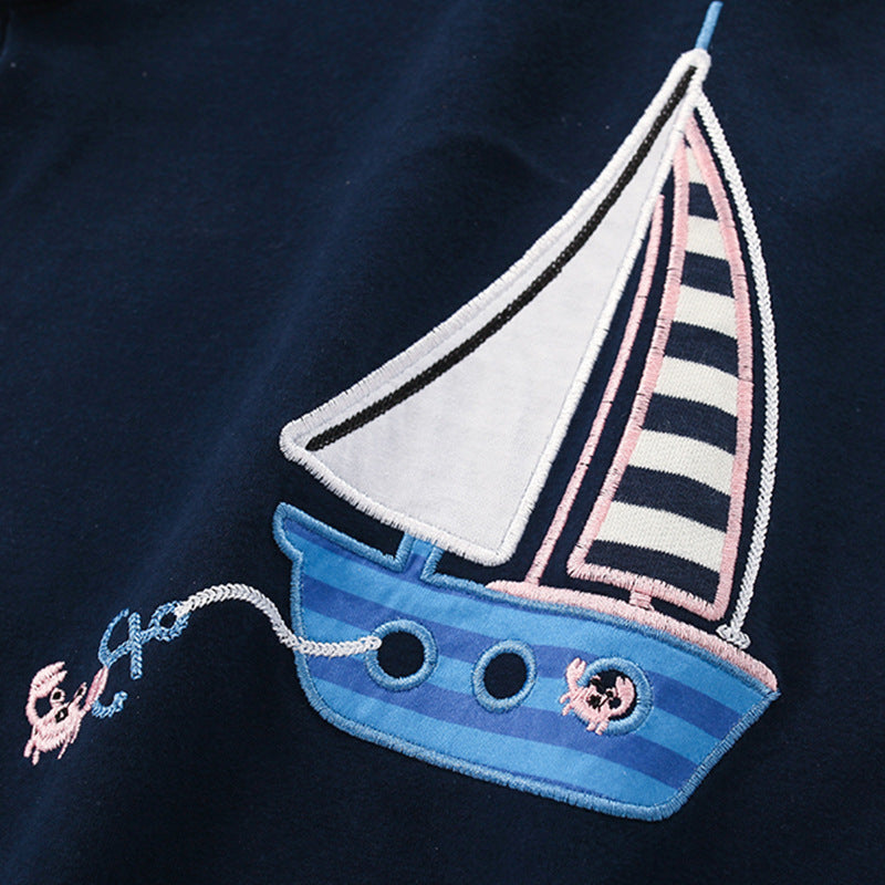 Navy blue t-shirt for boys featuring a cartoon sailboat pattern, perfect for summer wear.