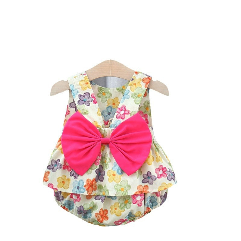 A vibrant sleeveless top dress for baby girls featuring a colorful floral pattern, perfect for summer wear.