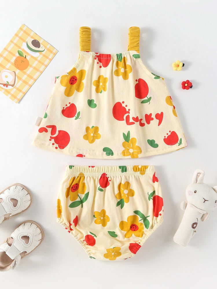 A bright yellow sleeveless dress with a floral pattern designed for baby girls, perfect for summer outings.