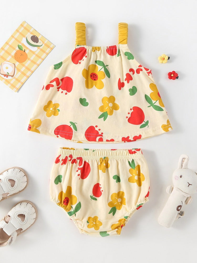 A bright yellow sleeveless dress with a floral pattern designed for baby girls, perfect for summer outings.