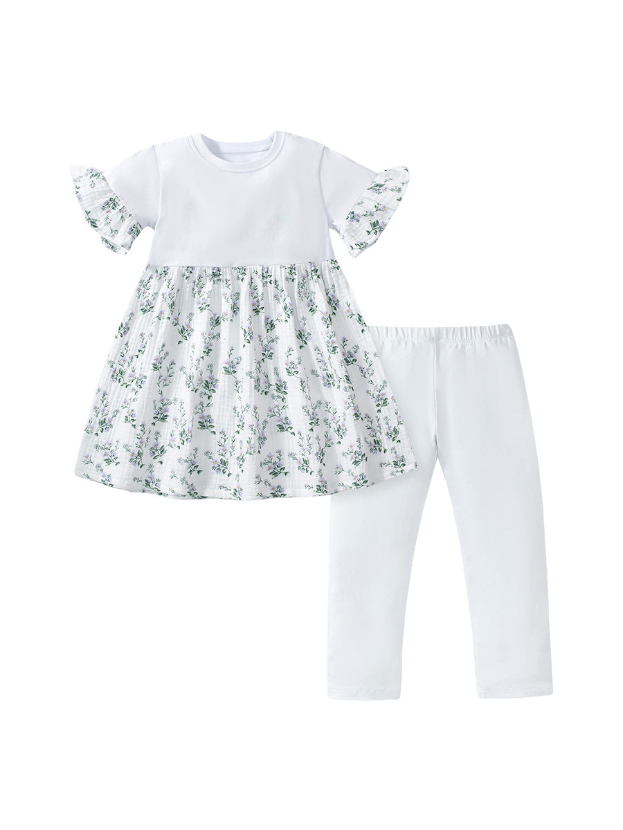 A stylish summer outfit for baby girls featuring a floral print patchwork dress and white pants, perfect for warm weather occasions.