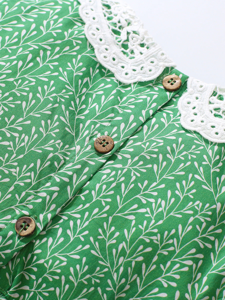 A vibrant green summer dress for girls featuring a lace collar and floral vine print, perfect for warm weather occasions.