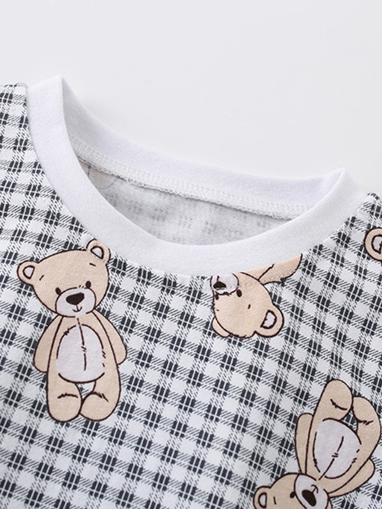 Light blue summer shirt for kids featuring a teddy bear pattern and plaid design, made from soft cotton material.