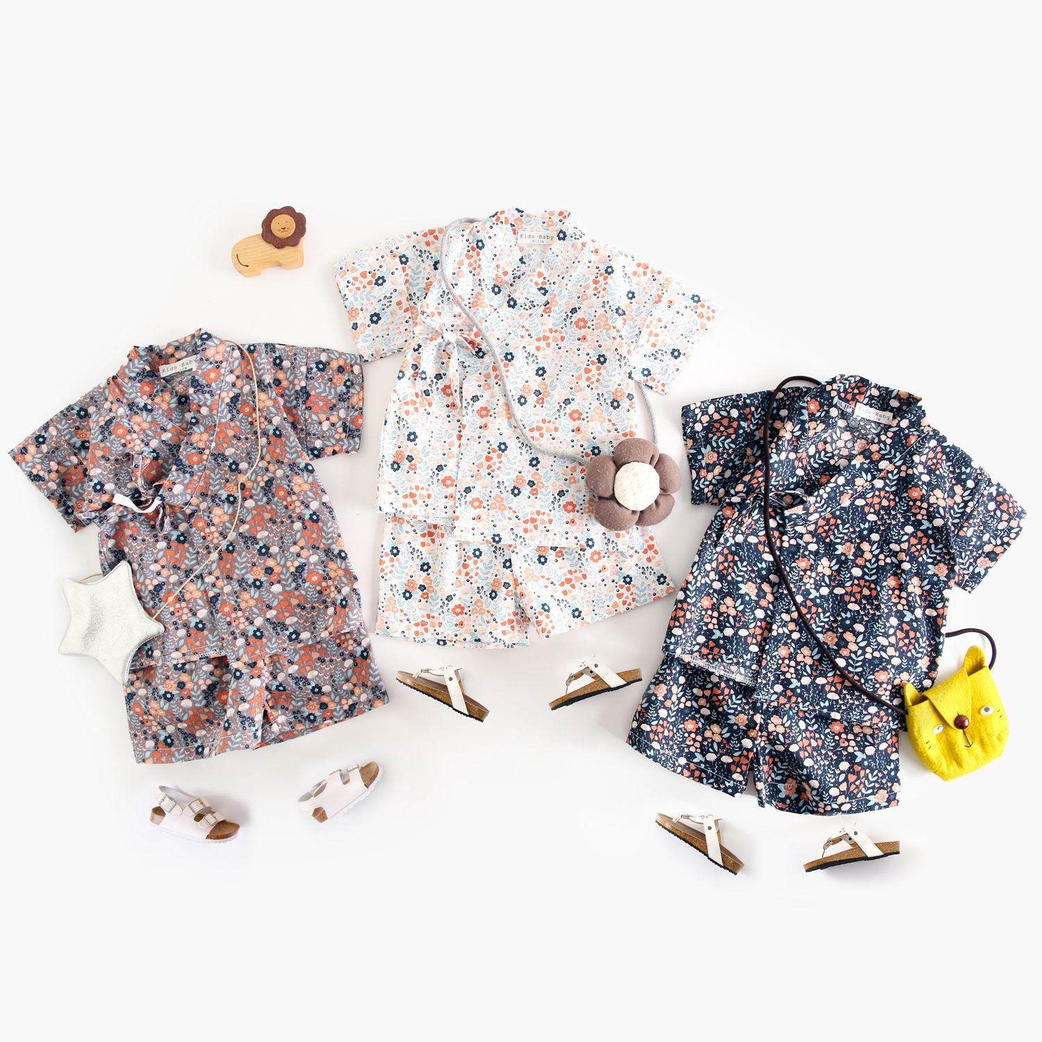 Summer Baby Kids Unisex Floral Print Casual V Neck T-Shirt and Shorts in white, navy blue, and brown colors, showcasing floral patterns.