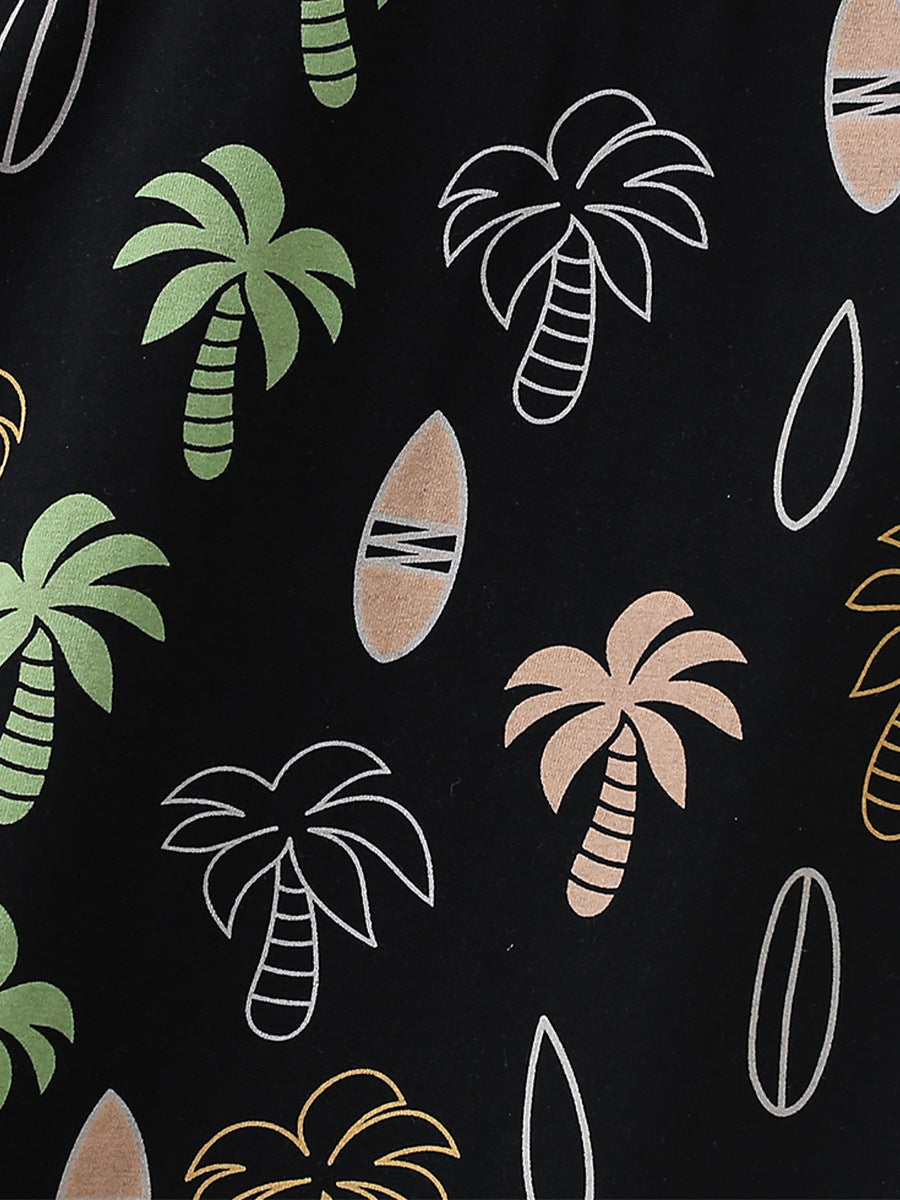 A stylish black short-sleeve shirt for kids featuring a tropical coconut tree pattern, perfect for summer wear.