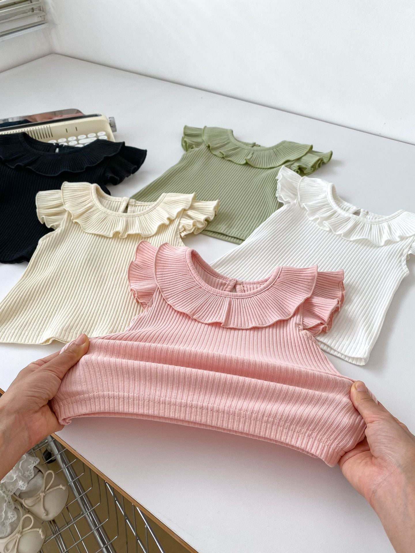 Girls’ Fly Sleeves Ruffle Collar Solid Color Top in various colors, showcasing its stylish design and soft fabric.