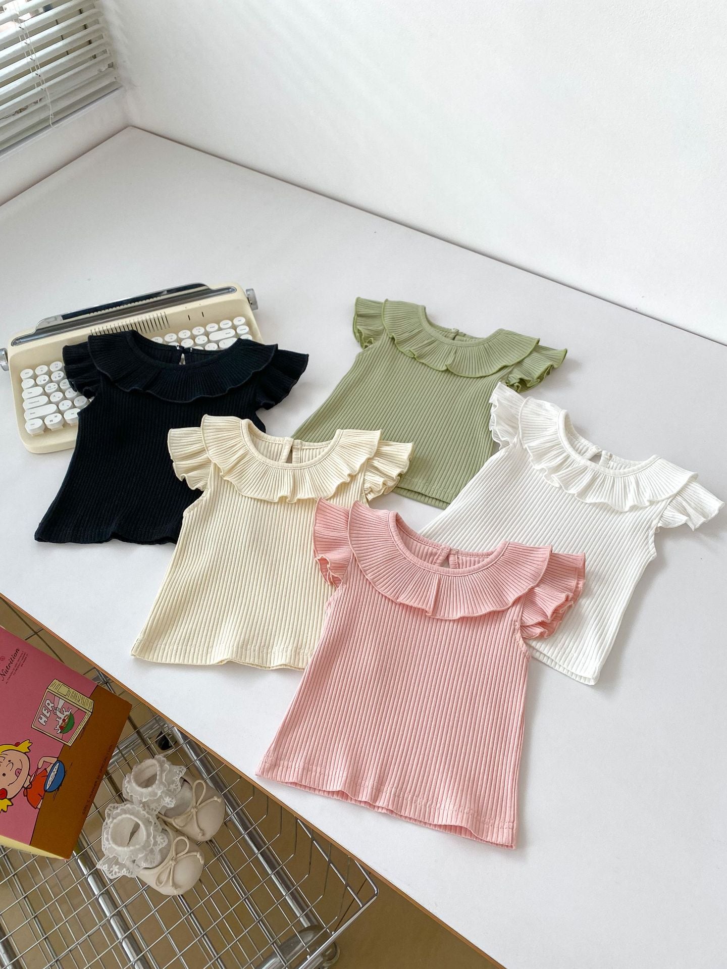 Girls’ Fly Sleeves Ruffle Collar Solid Color Top in various colors, showcasing its stylish design and soft fabric.