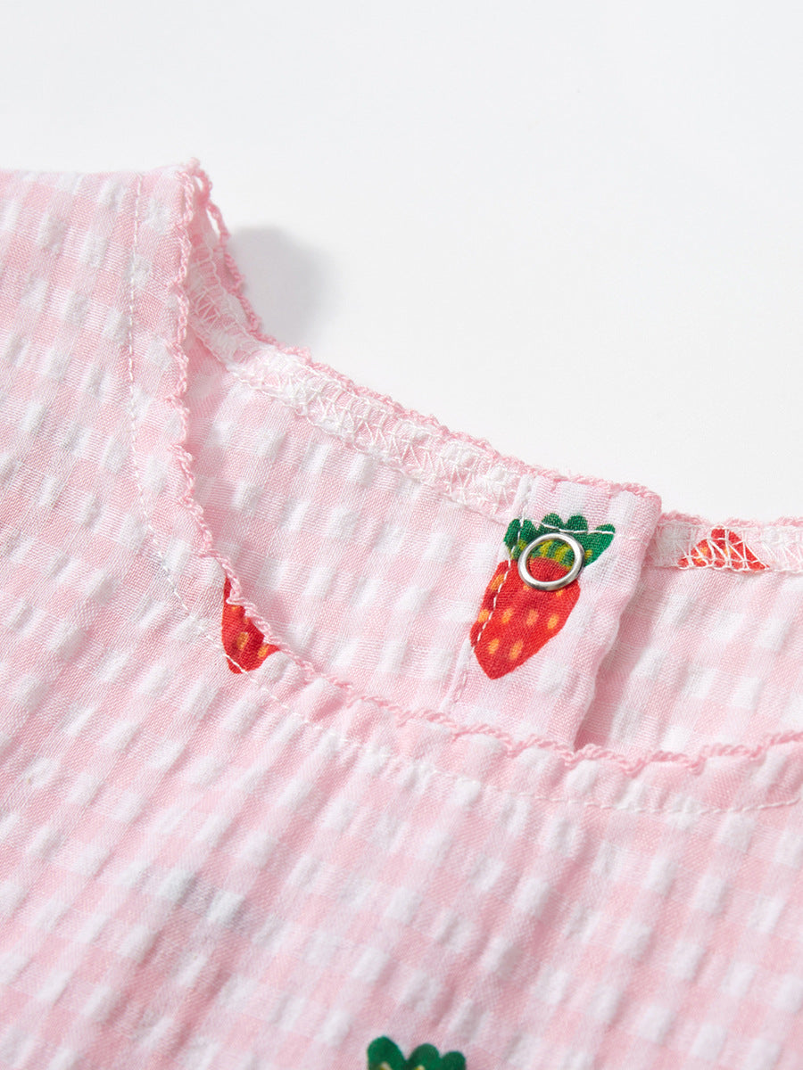 A vibrant pink sleeveless dress for girls featuring a playful carrots print pattern and plaid design, perfect for summer wear.