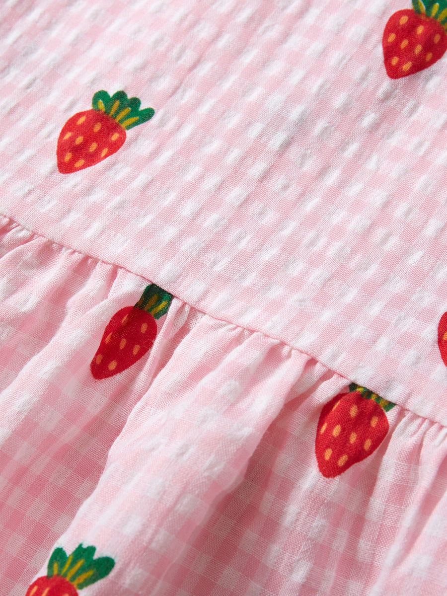 A vibrant pink sleeveless dress for girls featuring a playful carrots print pattern and plaid design, perfect for summer wear.