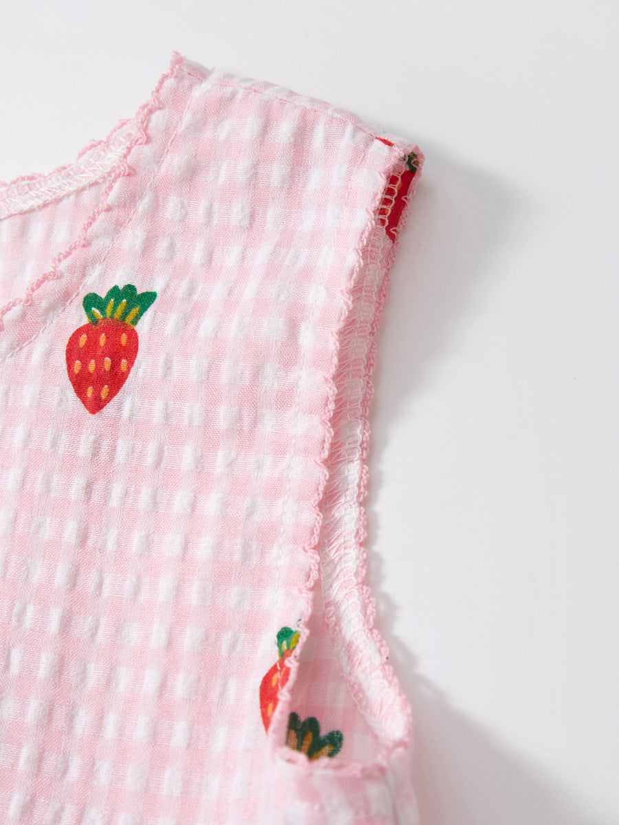 A vibrant pink sleeveless dress for girls featuring a playful carrots print pattern and plaid design, perfect for summer wear.