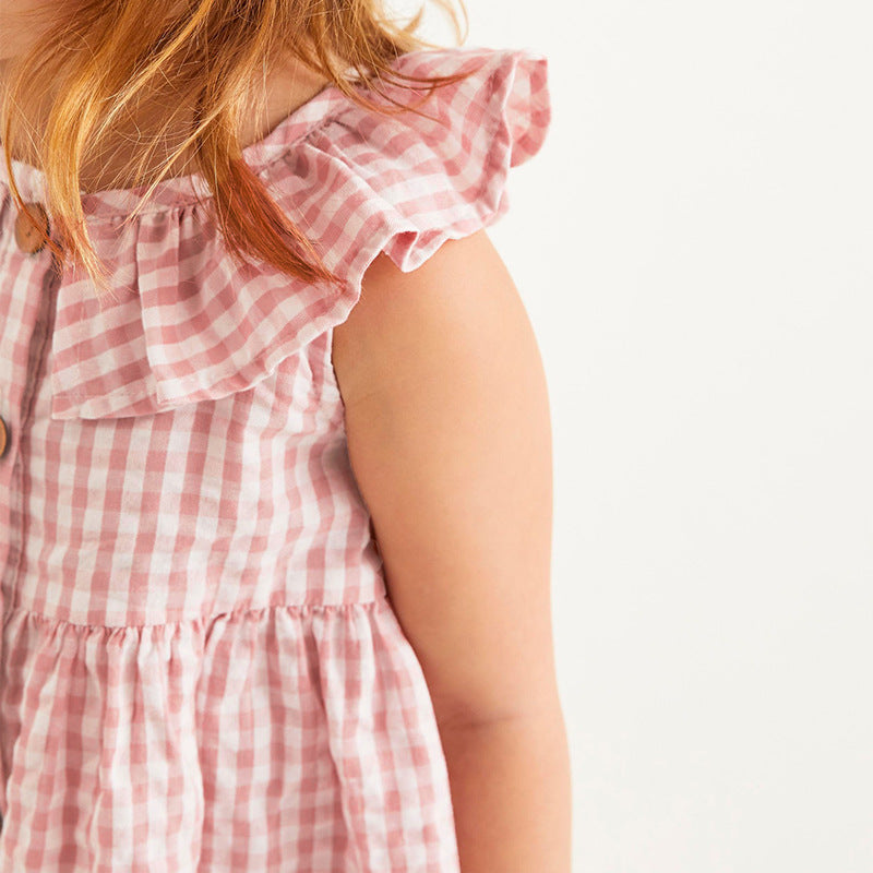 A pink sleeveless dress for girls featuring a plaid and cartoon mushroom house pattern, perfect for summer wear.