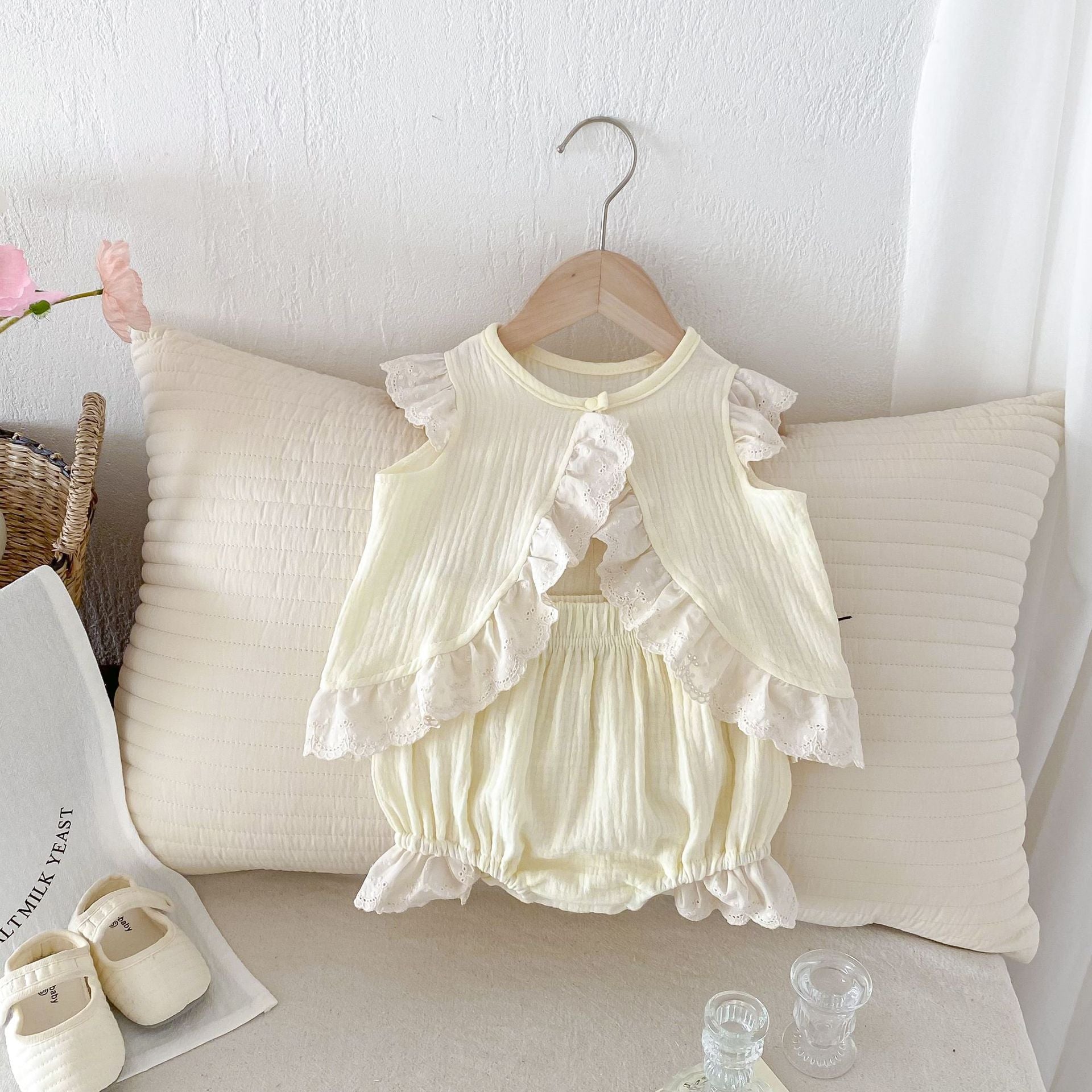 A stylish apricot dress for baby girls featuring fly sleeves and hollow out lace trim, perfect for summer wear.