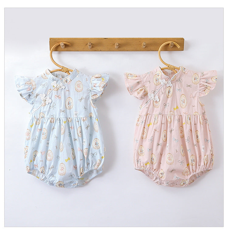 A cute summer dress for baby girls featuring a rabbits print, fly sleeves, and a stand collar in pink and blue colors.