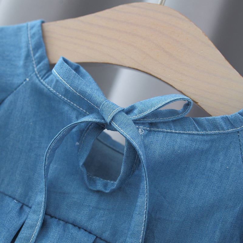 A stylish blue summer top for baby girls featuring fly sleeves and a crew neck design, made from soft cotton and denim material.