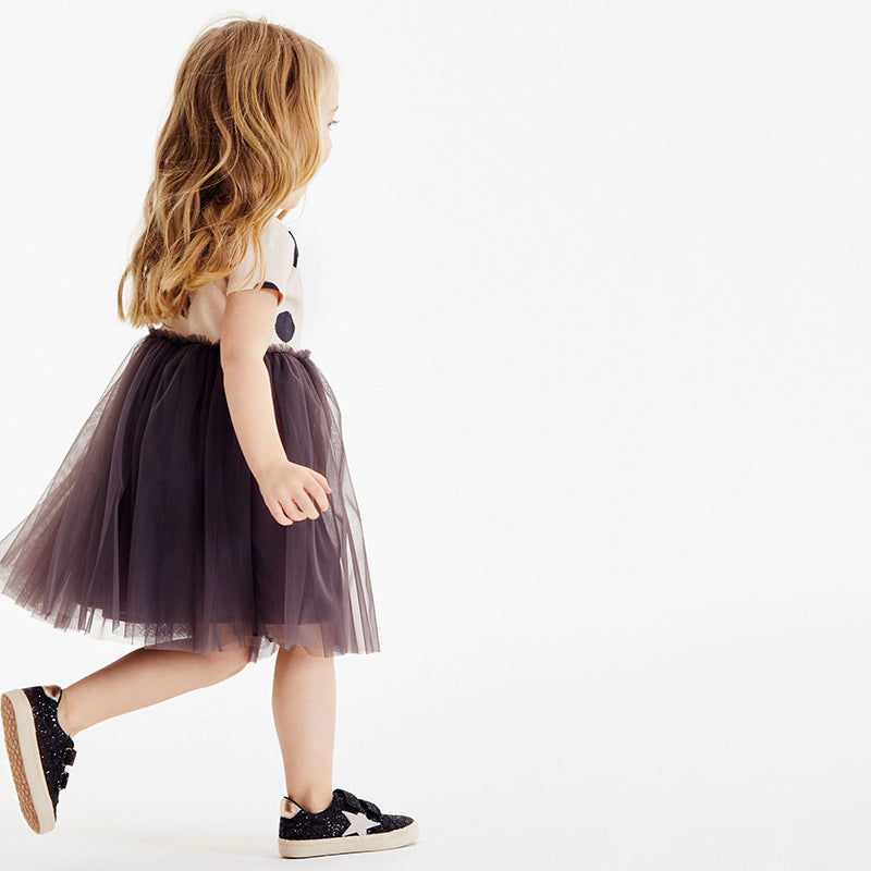 A stylish summer dress for girls featuring short sleeves, a polka dot pattern, and mesh patchwork, perfect for warm weather.