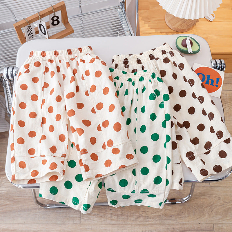 Summer Kids Girls Casual Pants featuring a soft, breathable fabric with a playful polka dots pattern in pink, green, and coffee colors.