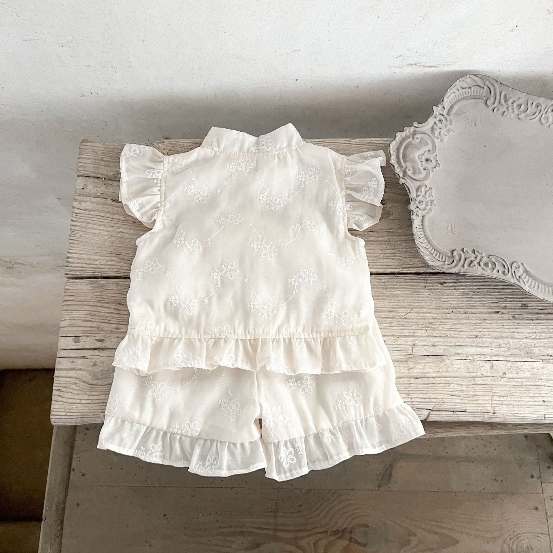 Summer dress for baby girls featuring fly sleeves and a stand collar in beige cotton with embroidered details.