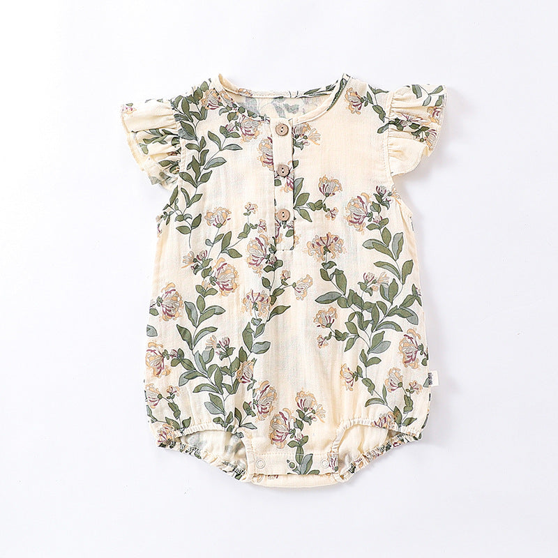 A cute baby girl wearing a floral print dress with fly sleeves in blue and gold, perfect for summer outings.