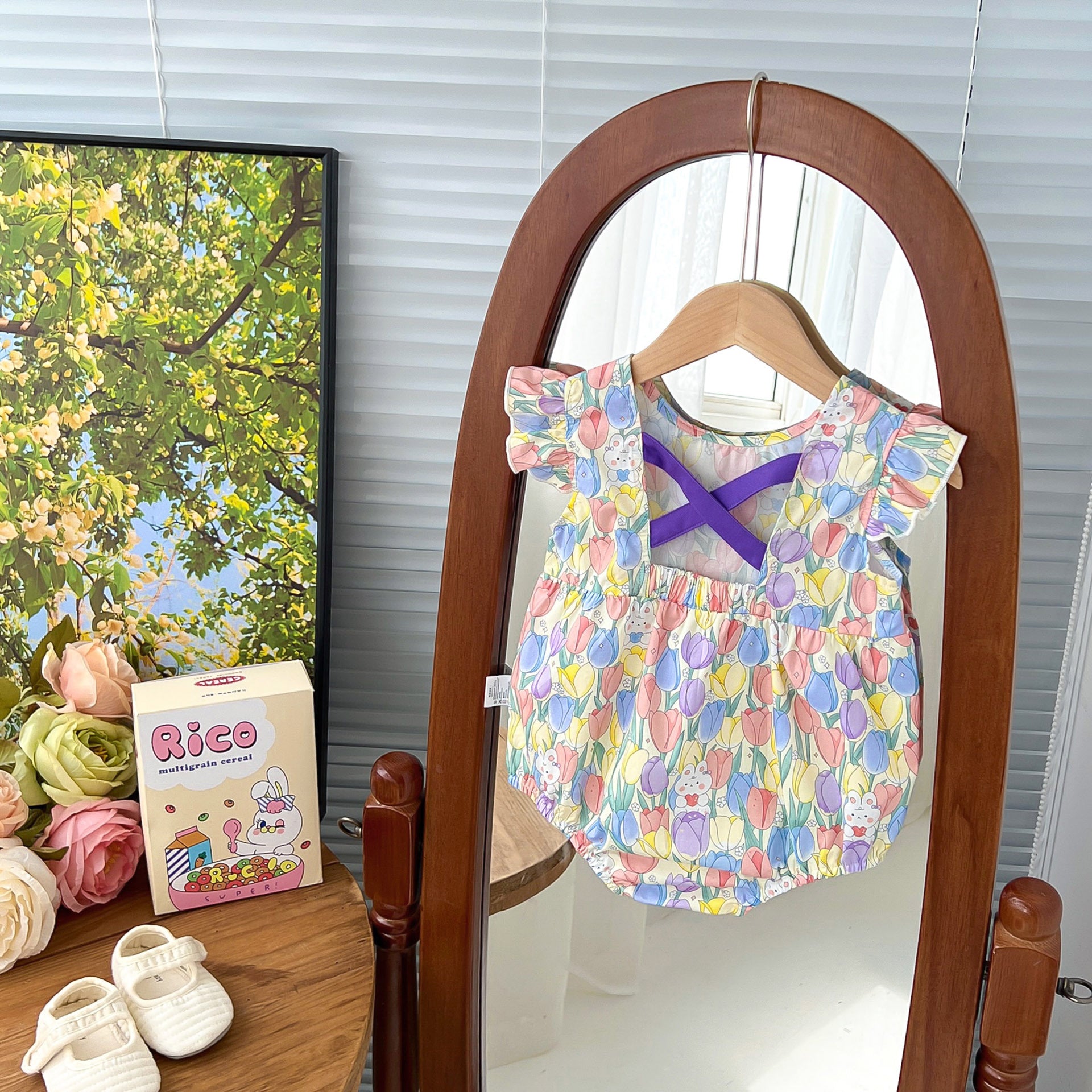 A cute purple dress for baby girls featuring a rabbits and flowers print with fly sleeves, perfect for summer outings.