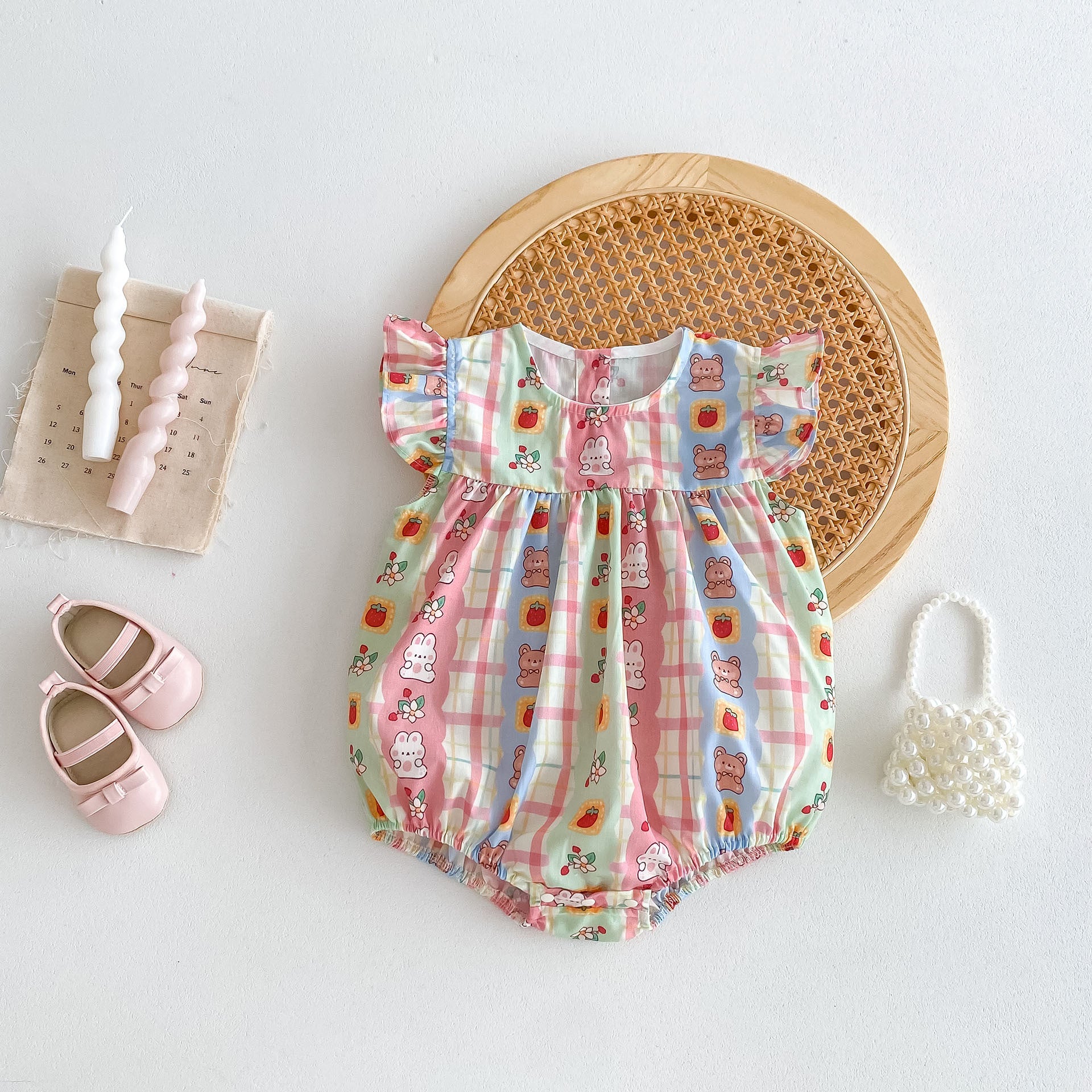 A cute summer outfit for baby girls featuring a rabbits print and plaid design with fly sleeves, perfect for warm weather.