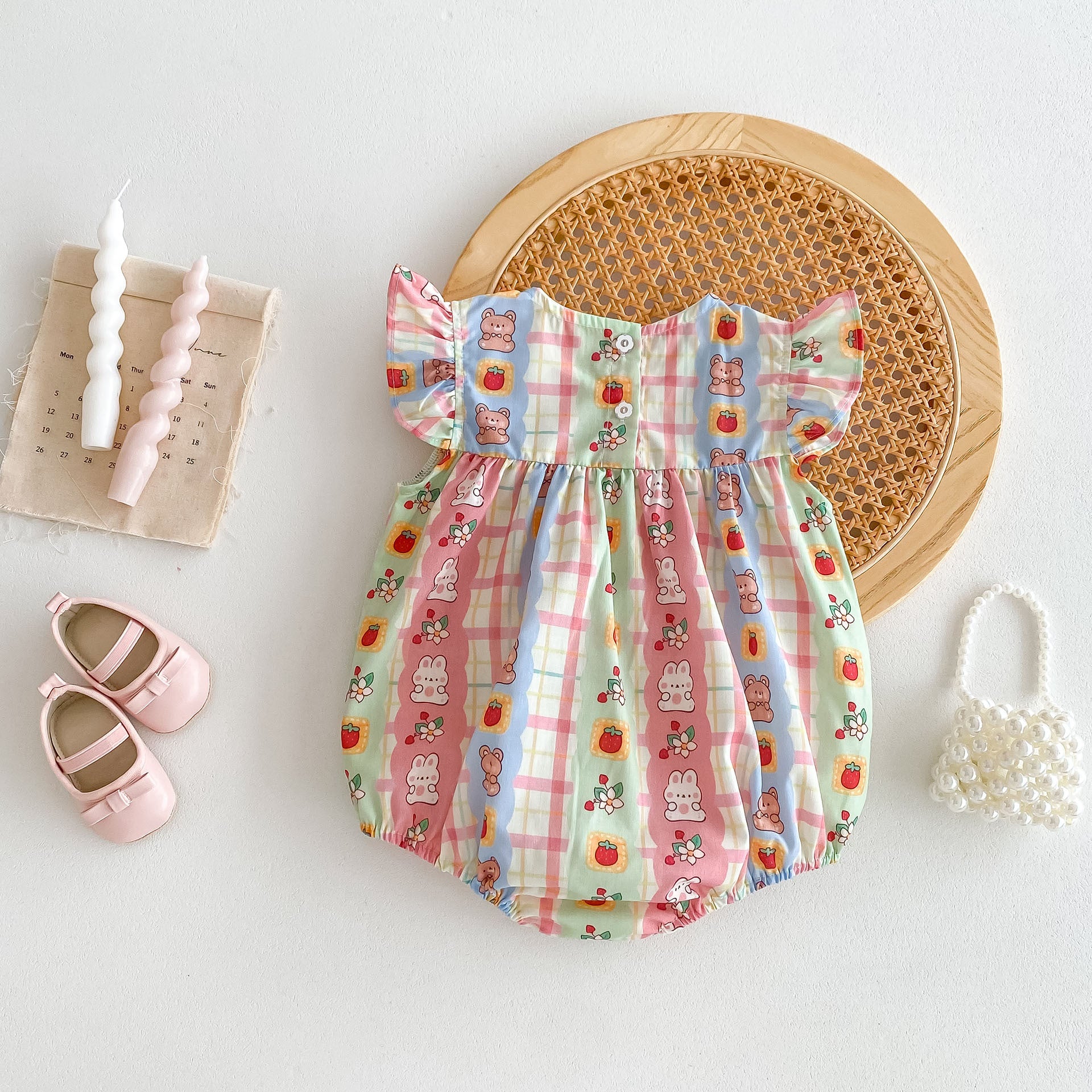 A cute summer outfit for baby girls featuring a rabbits print and plaid design with fly sleeves, perfect for warm weather.